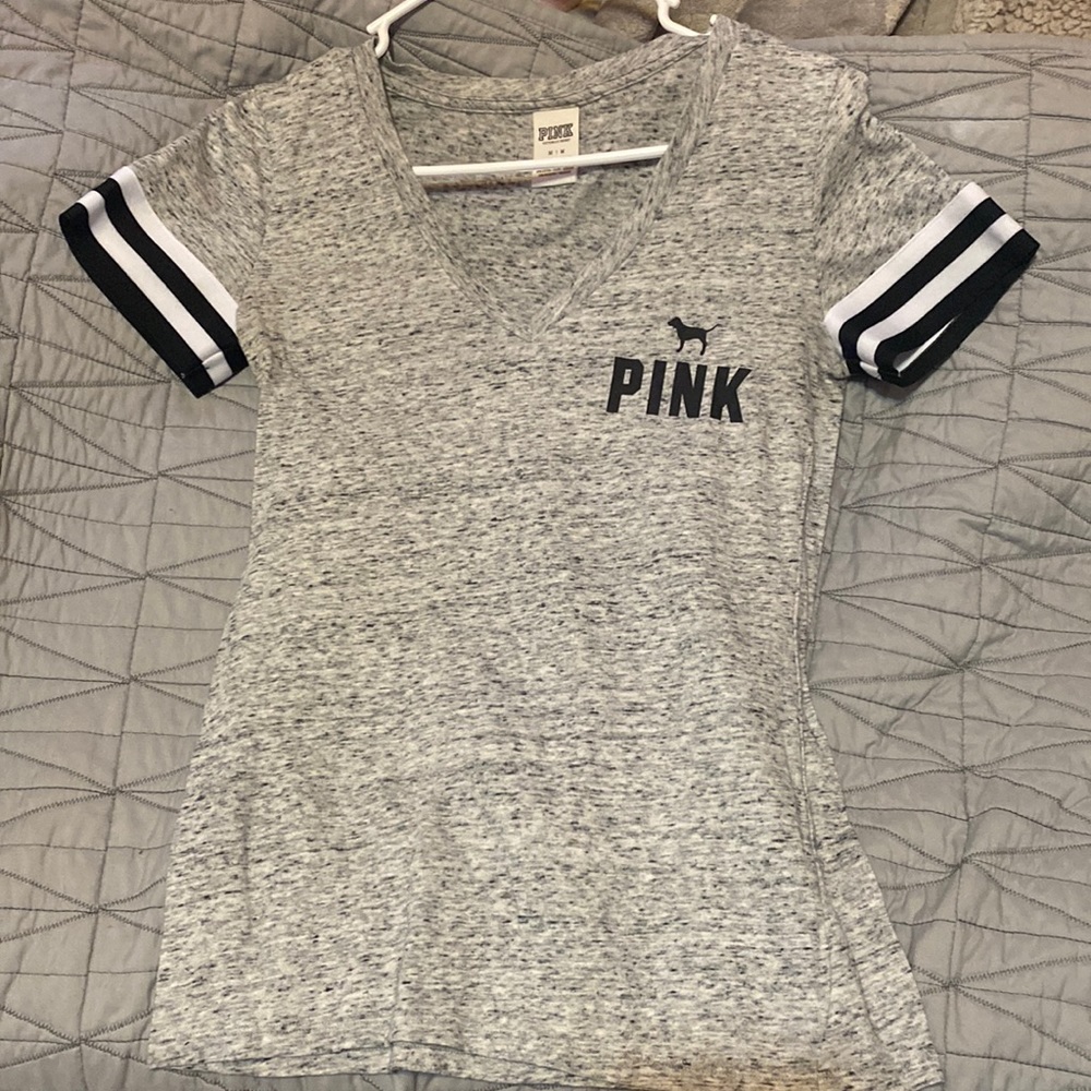 pink size medium shirt. worn maybe 1-2 times. shirt has no holes or faults.